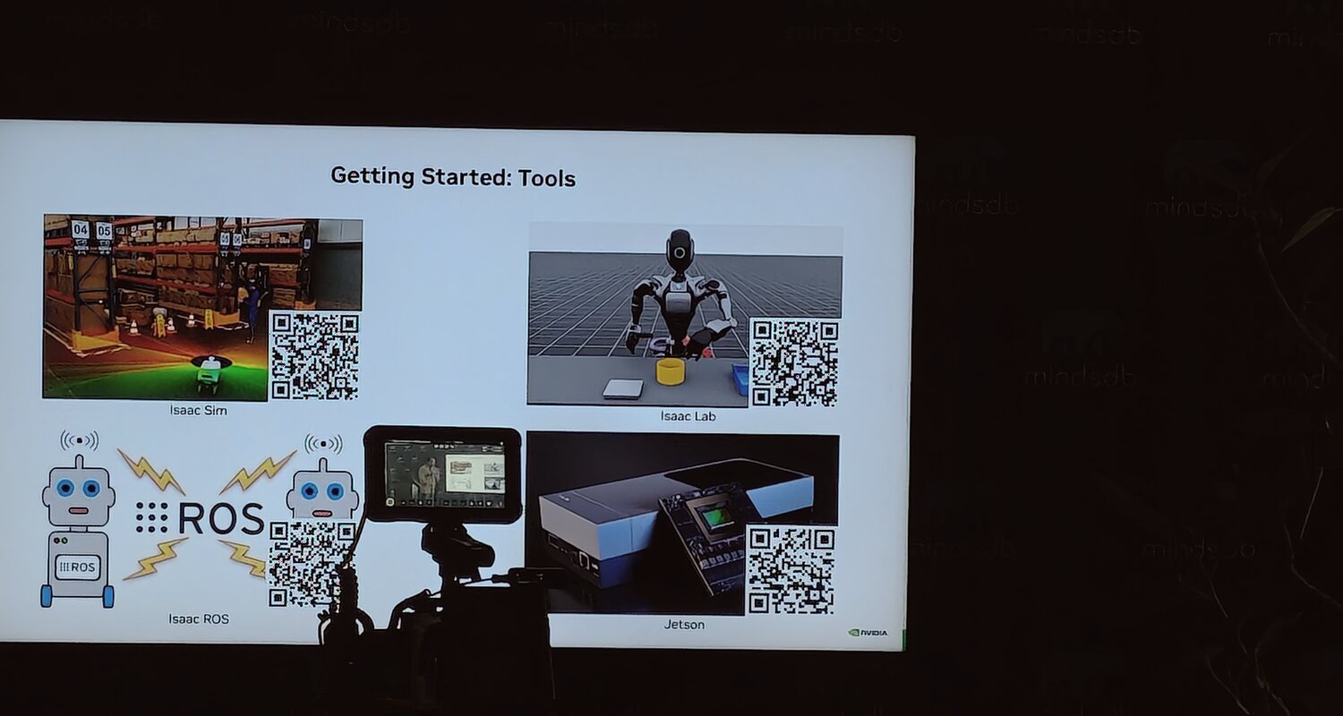 A presentation slide showing Isaac Sim, Isaac Lab, Isaac ROS, and Jetson